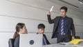 Aggressive boss businessman holding paper file work and complain staff and colleague in meeting conference room Royalty Free Stock Photo