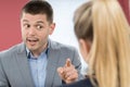 Aggressive Businessman Bullying Female Colleague In Office