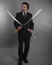 Aggressive businessman with Japanese swords in defensive and def Royalty Free Stock Photo