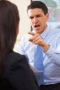 Aggressive Businessman Shouting At Female Colleague Royalty Free Stock Photo