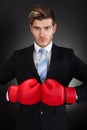 Aggressive Businessman Wearing Boxing Gloves