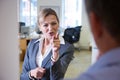 Aggressive Businesswoman Shouting At Male Colleague Royalty Free Stock Photo