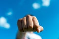 Aggressive caucasian teenage boy showing hes fist to the camera outdoors Royalty Free Stock Photo