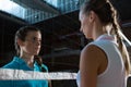 Aggressive female volleyball players looking through net Royalty Free Stock Photo