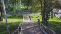 Aggressive inline roller blader grind on rail in skatepark outside. Clip. Summer extreme sport exercising outdoor in