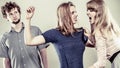 Aggressive mad women fighting over man. Royalty Free Stock Photo