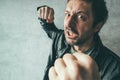 Aggressive man punching with fist, victim`s pov Royalty Free Stock Photo