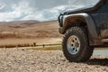 Aggressive off road ready car in mountains Royalty Free Stock Photo