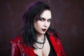 Aggressive punk woman, in red leather jacket