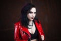 Aggressive punk woman, in red leather jacket