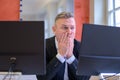 Aghast businessman looking at his computer screen Royalty Free Stock Photo