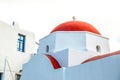 Agia Kyriaki Church, typical Greek church white building with red dome against the blue sky on the island Mykonos Royalty Free Stock Photo