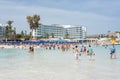 Agia Napa, Cyprus - April 07, 2018: Tourists walking and bathing on Nissi beach Royalty Free Stock Photo