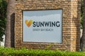 AGIA NAPA, CYPRUS - MAY 26, 2019: the Sunwing Sandy Bay Beach Hotel signboard, Ayia Napa. This sign is set in the bushes