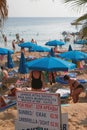 Agia Napa, Cyprus - Oct 26, 2019: Beach stand with cost of beach sunbeds and umbrella