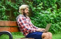 Agile business. mature student working on computer. go shopping on cyber monday. bearded man on bench with laptop