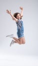 Agile energetic young girl leaping high