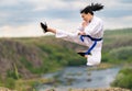 Agile sporty young woman kickboxing Royalty Free Stock Photo