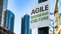 Agile Working Culture on Worn Sign in Downtown city setting