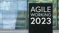 Agile Working 2023 sign in front of a modern office building