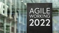 Agile Working 2022 sign in front of a modern office building