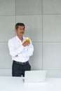 Aging businessman or retirement man have a good health drinking organic and fresh orange juice working with notebook. Asian man Royalty Free Stock Photo