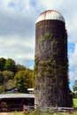 Aging Grain Silo Stands Behind Rustic Fence