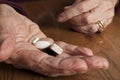 Aging and Health Care - hands and pills