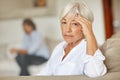 Aging is not for sissies. a senior woman looking sad while sitting on the sofa at home.