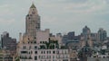 An aging setback style skyscraper rises above a portion of the NYC skyline