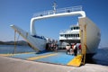 Agiokampos, Evia island, Greece - August 15, 2023: People on summer vacation entering ferryboat at Agiokampos, Evia ilsand.