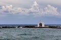 Agios Nikolaos Chapel, Georgioupoli, Crete, white chapel is built on a small rocky islet and is dedicated to Saint Nicholas. Agios Royalty Free Stock Photo