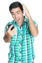 Agitated man yelling at his mobile phone Royalty Free Stock Photo