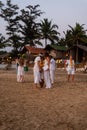 Agonda Beach, Goa/India- February 22 2020: Caucasian Tourists and families relaxing and enjoying on the beach at Agonda Beach