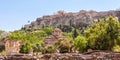 Agora in Athens, Greece. Panoramic view of ancient Greek ruins and Acropolis in distance Royalty Free Stock Photo