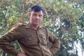 AGRA, INDIA - DECEMBER 2012: Indian police officer looking at camera on a river bank