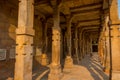 Agra, India - September 20, 2017: Columns with stone carving in courtyard of Quwwat-Ul-Islam mosque, Qutub Minar complex