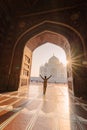 tourist standing in front entrance gate of Taj Mahal indian palace. Islam architecture. Door to the mosque Royalty Free Stock Photo