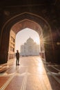 tourist standing in front entrance gate of Taj Mahal indian palace. Islam architecture. Door to the mosque Royalty Free Stock Photo