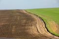 Agrarian fields after heavy rain, deposits of chernozem and various debris on the field