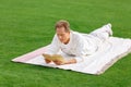 Agreeable man lying on the grass Royalty Free Stock Photo