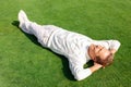 Agreeable man lying on the grass