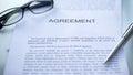 Agreement lying on table, pen and eyeglasses on official document, business Royalty Free Stock Photo