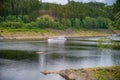 Agrement passanger boat cruising on a natural lake between mountains on a summar day