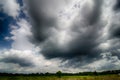 Agressive thunderstorm cloouds sky over farm land Royalty Free Stock Photo