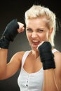 Agressive young beautiful blond boxer girl