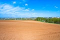 Agricultural arable land field in the spring for crops Royalty Free Stock Photo
