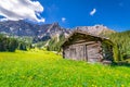 Agricultural barn for hay in Dolomites meadows, Northern Italy