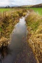 Drainage Ditch on a Farm Royalty Free Stock Photo