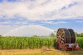 Water sprinkler installation in a field of corn. Royalty Free Stock Photo